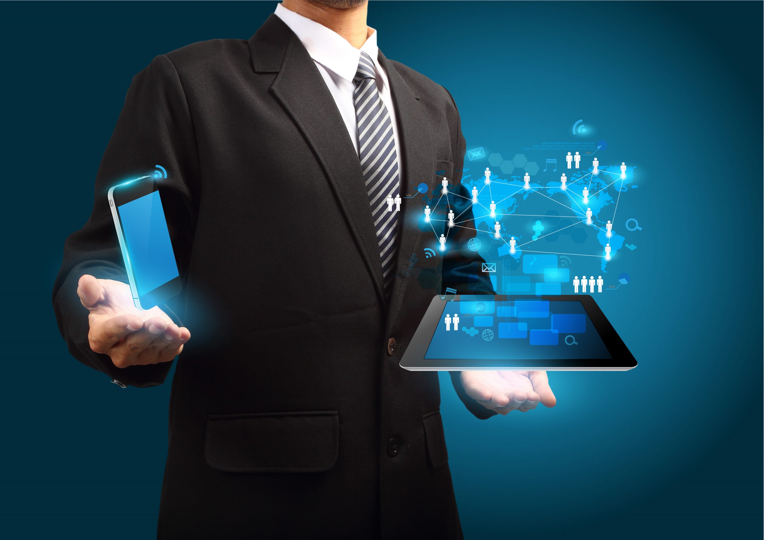 a man in a suit holding a tablet.