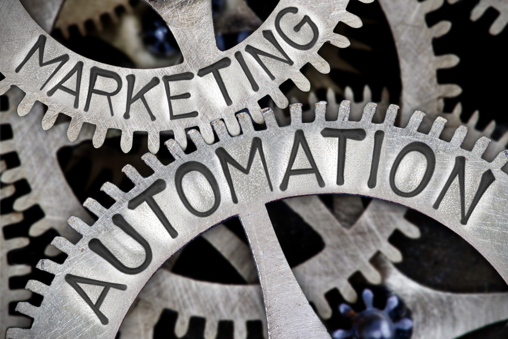 The word marketing automation is written on a set of gears.