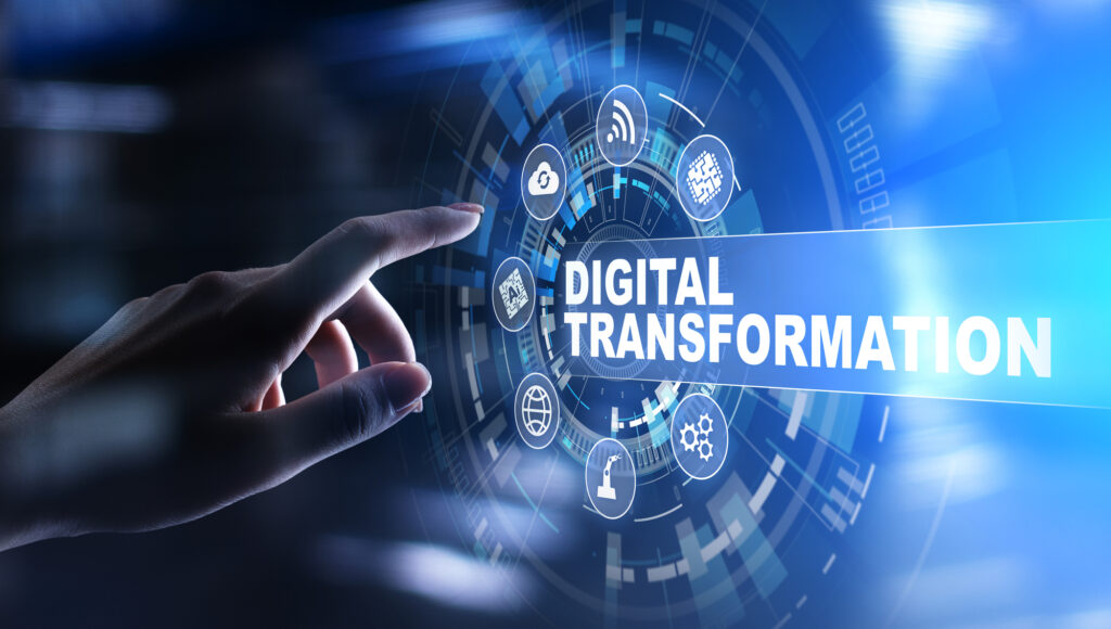 A hand reaches towards futuristic icons, with the text "Digital Transformation" in the center, symbolizing technological advancement and modern innovation.