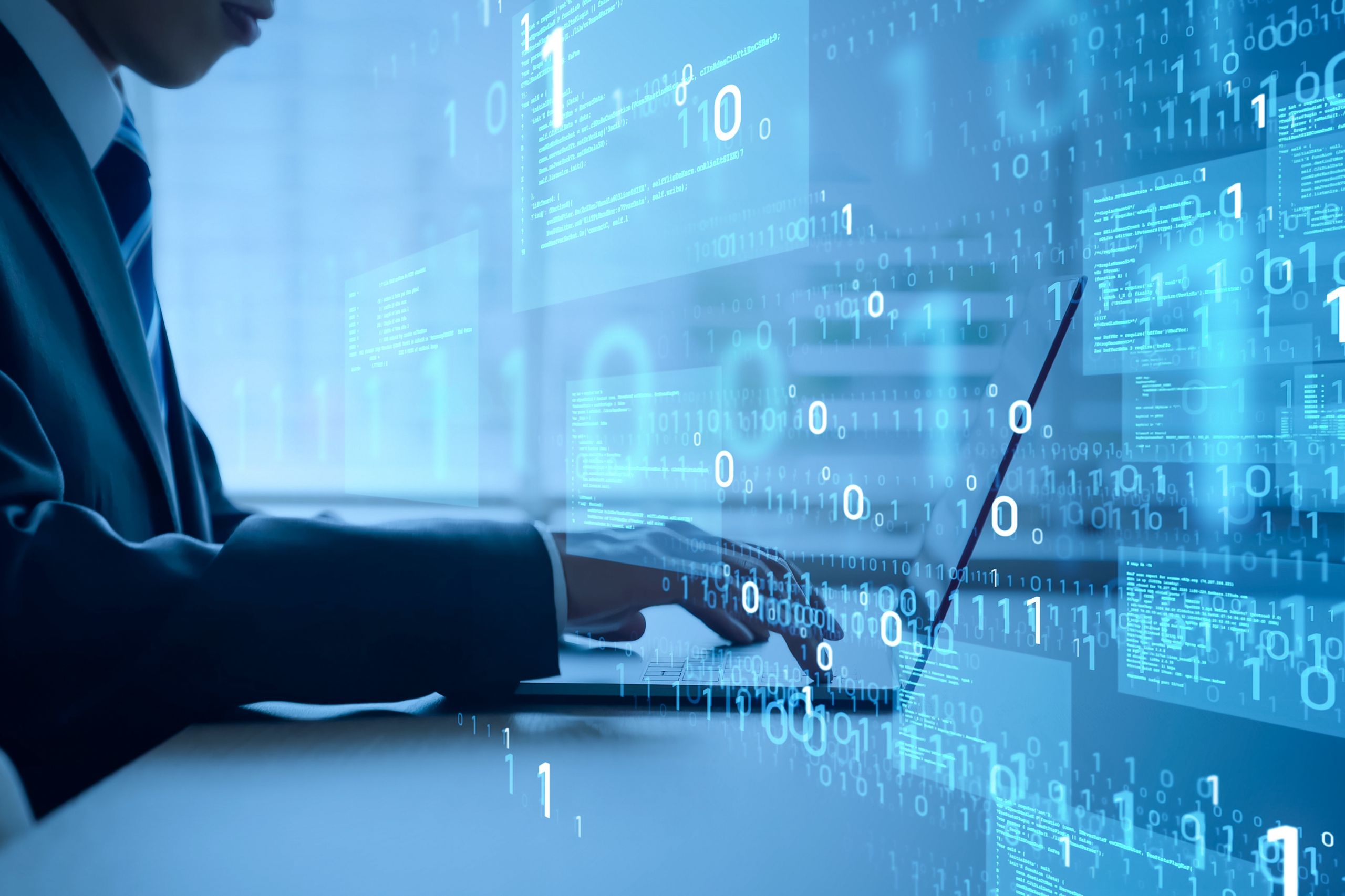 Person typing on a laptop surrounded by floating binary code and digital data, symbolizing programming, cybersecurity, or information technology work—an ideal representation of Fractional CIO expertise and Fractional Technology Leadership in today’s digital landscape.