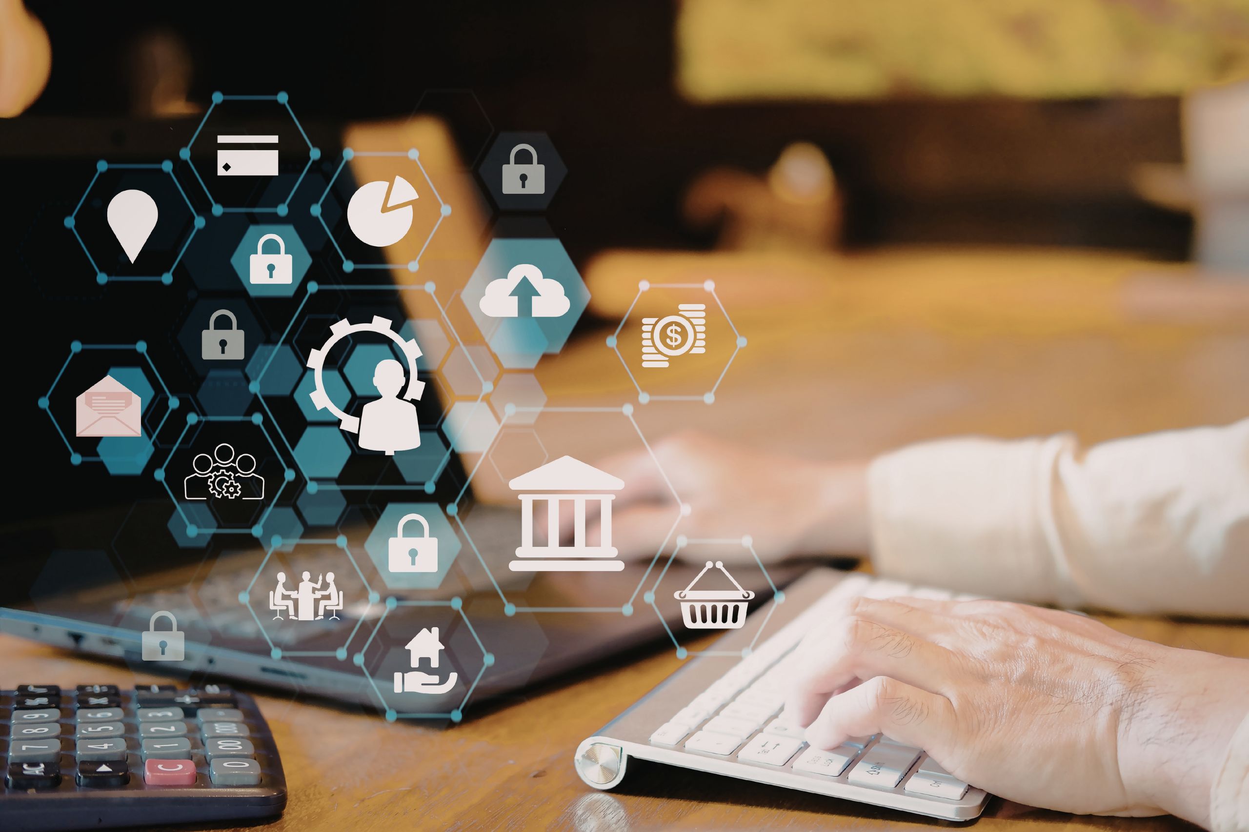 Hands typing on a keyboard with financial and security icons overlaid, suggesting digital banking, cybersecurity concepts, and the importance of a Digital Transformation Strategy in today's technology-driven landscape.